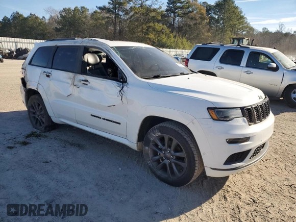 2018 Jeep Grand Cherokee High Altitude with VIN 1C4RJECG1JC125602, listed as a Copart auction lot 88702275 with 59,701 mi miles and Salvage title. Bid and sale history available at DreamBid. Image 4.