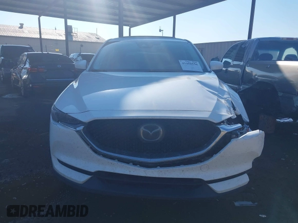 2017 Mazda CX-5 Grand Touring with VIN JM3KFBDL6H0164993, listed as a IAAI auction lot 41450556 with 97,733 mi miles. Bid and sale history available at carsss.com. Image 12.