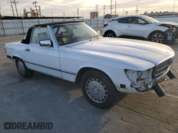 1989 Mercedes-Benz 560 Series 560SL with VIN WDBBA48D7KA100290, listed as a Copart auction lot 85049924 with 88,919 mi miles and Salvage Title. Bid and sale history available at carsss.com. Image 4.