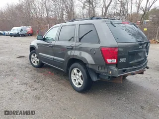 2005 Jeep Grand Cherokee Laredo with VIN 1J4GR48K35C702010, listed as a IAAI auction lot 41043017 with 150,565 mi miles. Bid and sale history available at carsss.com. Image 3.