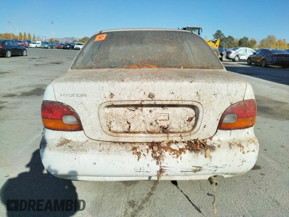 1997 Hyundai Accent z VIN KMHVF24NXVU373676, wystawiony jako Copart lot #77866484 z przebiegiem 151 949 mil mil oraz Tytuł czysty. Historia ofert i sprzedaży dostępna na DreamBid. Obrazek 6.