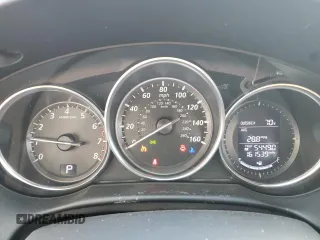 2014 Mazda CX-5 Touring z VIN JM3KE2CY0E0412733, wystawiony jako Copart lot #55803865 z przebiegiem 161 539 mil mil oraz Szkoda całkowita • Salvage title. Historia ofert i sprzedaży dostępna na DreamBid. Obrazek 9.