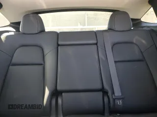 2023 Tesla Model Y Performance with VIN 7SAYGDEF3PF946496, listed as a Copart auction lot 50800315 with 15,077 mi miles and Salvage Title. Bid and sale history available at DreamBid. Image 10.
