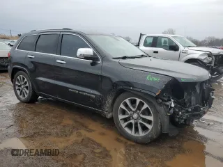 2017 Jeep Grand Cherokee Overland with VIN 1C4RJFCG0HC836448, listed as a Copart auction lot 47053705 with 87,459 mi miles and Salvage Title. Bid and sale history available at carsss.com. Image 4.