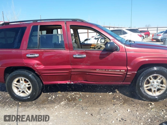 1999 Jeep Grand Cherokee Limited with VIN 1J4GW68N3XC770468, listed as a IAAI auction lot 41793600 with 65,277 mi miles. Bid and sale history available at carsss.com. Image 13.