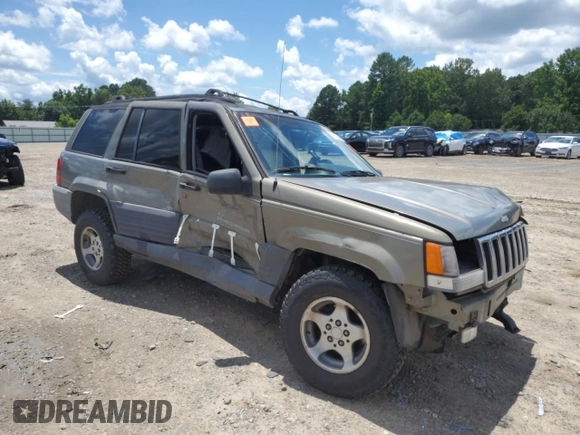 1997 Jeep Grand Cherokee Laredo with VIN 1J4GZ58S7VC505069, listed as a Copart auction lot 63255945 with 127,552 mi miles and Salvage title. Bid and sale history available at DreamBid. Image 4.
