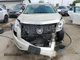2015 Cadillac SRX Luxury Collection z VIN 3GYFNEE31FS510316, wystawiony jako Copart lot #56652955 z przebiegiem 83 252 mil mil oraz Szkoda całkowita • Salvage title. Historia ofert i sprzedaży dostępna na DreamBid. Obrazek 5.