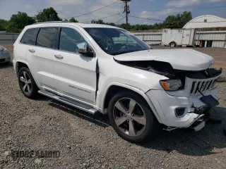 2015 Jeep Grand Cherokee Overland with VIN 1C4RJFCG6FC797653, listed as a Copart auction lot 65186695 with Not provided miles and Salvage title. Bid and sale history available at DreamBid. Image 4.