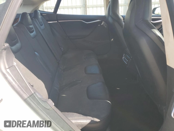 2013 Tesla Model S with VIN 5YJSA1AC7DFP10881, listed as a Copart auction lot 61485235 with 107,032 mi miles and Salvage title. Bid and sale history available at DreamBid. Image 10.