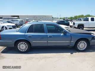 2009 Mercury Grand Marquis LS with VIN 2MEHM75V09X634393, listed as a IAAI auction lot 41993456 with 153,862 mi miles. Bid and sale history available at carsss.com. Image 13.