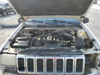 1996 Jeep Grand Cherokee Laredo z VIN 1J4EX58S3TC144191, wystawiony jako Copart lot #53153495 z przebiegiem 197 853 mil mil oraz Szkoda całkowita • Salvage title. Historia ofert i sprzedaży dostępna na DreamBid. Obrazek 11.