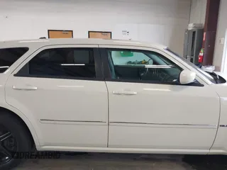 2006 Dodge Magnum z VIN 2D8GZ57286H100782, wystawiony jako IAAI lot #41816780 z przebiegiem 203 839 mil mil oraz . Historia ofert i sprzedaży dostępna na DreamBid. Obrazek 13.