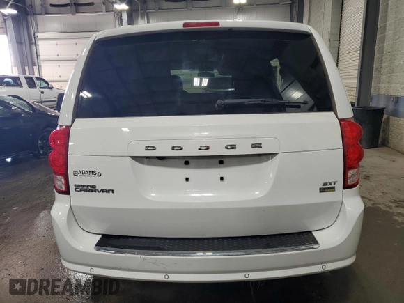 2014 Dodge Grand Caravan SXT with VIN 2C4RDGCG6ER427435, listed as a Copart auction lot 51957355 with 106,078 mi miles and Salvage Title. Bid and sale history available at DreamBid. Image 6.