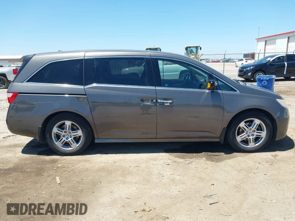 2012 Honda Odyssey Touring with VIN 5FNRL5H93CB109394, listed as a IAAI auction lot 42280018 with 190,412 mi miles and . Bid and sale history available at DreamBid. Image 13.