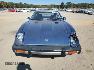 1979 Datsun 280ZX z VIN HS130133365, wystawiony jako Copart lot #77113584 z przebiegiem 99 721 mil mil oraz Szkody całkowita. Historia ofert i sprzedaży dostępna na DreamBid. Obrazek 5.