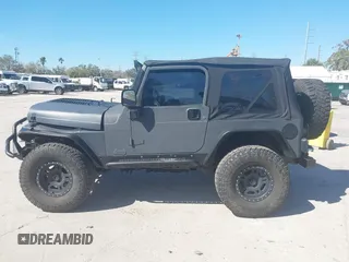 2003 Jeep Wrangler X with VIN 1J4FA39S03P314685, listed as a IAAI auction lot 41649741 with 119,924 mi miles. Bid and sale history available at carsss.com. Image 15.