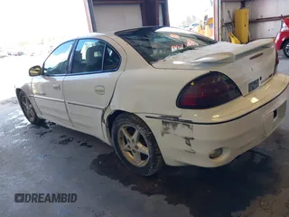 1999 Pontiac Grand Am GT1 with VIN 1G2NW52E2XM800431, listed as a IAAI auction lot 41620806 with 164,257 mi miles. Bid and sale history available at carsss.com. Image 3.