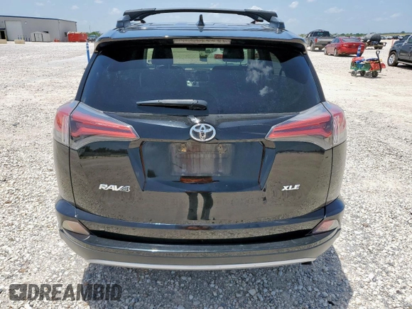 2018 Toyota RAV4 XLE with VIN 2T3WFREV7JW429716, listed as a Copart auction lot 64309045 with 156,445 mi miles and Salvage title. Bid and sale history available at DreamBid. Image 6.