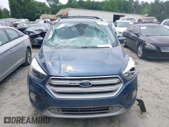 2018 Ford Escape Titanium with VIN 1FMCU0J99JUA12717, listed as a IAAI auction lot 42237509 with 123,896 mi miles and . Bid and sale history available at DreamBid. Image 6.