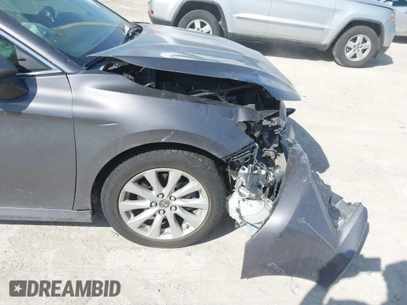 2019 Toyota Camry LE with VIN 4T1B11HK9KU810347, listed as a IAAI auction lot 41804007 with 75,063 mi miles and . Bid and sale history available at DreamBid. Image 18.