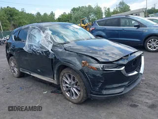2019 Mazda CX-5 Grand Touring with VIN JM3KFBDM8K1595586, listed as a IAAI auction lot 42562751 with 70,983 mi miles and . Bid and sale history available at DreamBid. Image 1.