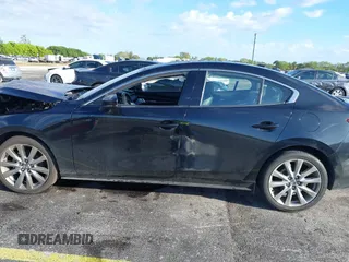2021 Mazda 3 Premium with VIN JM1BPADL7M1303484, listed as a IAAI auction lot 41666785 with 34,476 mi miles and . Bid and sale history available at DreamBid. Image 14.