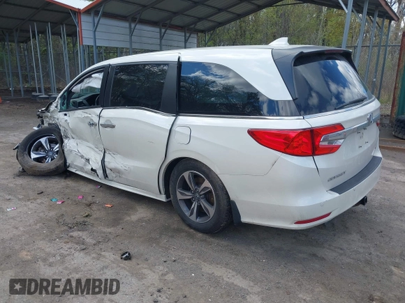 2018 Honda Odyssey Touring with VIN 5FNRL6H81JB023530, listed as a IAAI auction lot 42040124 with 109,128 mi miles and . Bid and sale history available at DreamBid. Image 3.