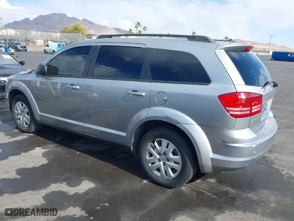 2016 Dodge Journey SE with VIN 3C4PDCAB0GT230512, listed as a IAAI auction lot 41434785 with 140,829 mi miles. Bid and sale history available at carsss.com. Image 3.