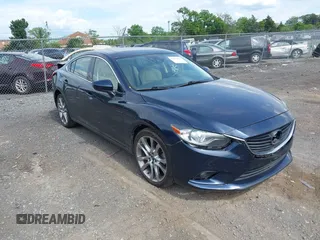 2015 Mazda 6 i Grand Touring with VIN JM1GJ1W53F1200121, listed as a IAAI auction lot 42173036 with 76,184 mi miles and . Bid and sale history available at DreamBid. Image 1.