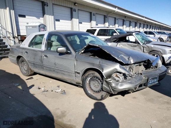 2000 Ford Crown Victoria with VIN 2FAFP73W8YX116581, listed as a Copart auction lot 42426805 with 122,218 mi miles and Salvage Title. Bid and sale history available at carsss.com. Image 4.
