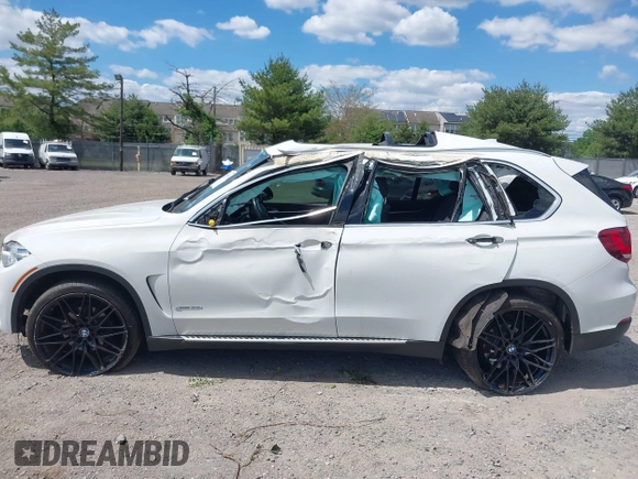 2017 BMW X5 xDrive35i z VIN 5UXKR0C30H0X79365, wystawiony jako IAAI lot #42209393 z przebiegiem Nie podano mil oraz . Historia ofert i sprzedaży dostępna na DreamBid. Obrazek 14.