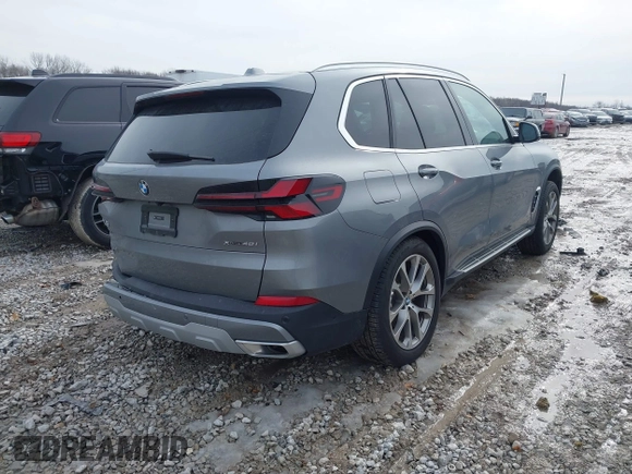 2025 BMW X5 xDrive40i with VIN 5UX23EU02S9X44610, listed as a IAAI auction lot 41469794 with 1,964 mi miles. Bid and sale history available at carsss.com. Image 4.
