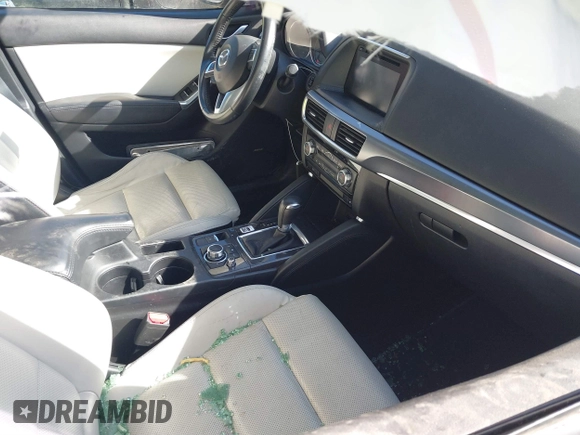 2016 Mazda CX-5 Grand Touring with VIN JM3KE4DY0G0709563, listed as a IAAI auction lot 41886956 with 156,769 mi miles. Bid and sale history available at carsss.com. Image 5.