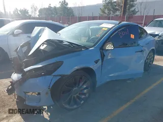 2022 Tesla Model 3 Performance with VIN 5YJ3E1EC1NF144236, listed as a IAAI auction lot 41189644 with Not Provided miles. Bid and sale history available at carsss.com. Image 2.