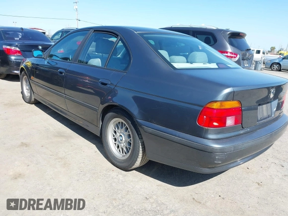 2000 BMW 5 Series 528iA with VIN WBADM6343YGV01651, listed as a IAAI auction lot 41745574 with 143,898 mi miles. Bid and sale history available at carsss.com. Image 3.