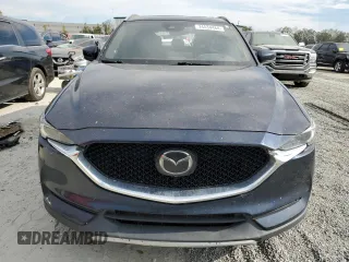 2021 Mazda CX-5 Signature with VIN JM3KFBEY3M0439658, listed as a Copart auction lot 74534464 with 50,816 mi miles and Salvage Title. Bid and sale history available at carsss.com. Image 5.