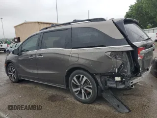 2018 Honda Odyssey Elite z VIN 5FNRL6H94JB107589, wystawiony jako Copart lot #58347385 z przebiegiem 98 761 mil mil oraz Szkody całkowita. Historia ofert i sprzedaży dostępna na DreamBid. Obrazek 2.