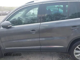 2014 Volkswagen Tiguan SE z VIN WVGAV3AX0EW576108, wystawiony jako IAAI lot #42405804 z przebiegiem 117 530 mil mil oraz . Historia ofert i sprzedaży dostępna na DreamBid. Obrazek 14.