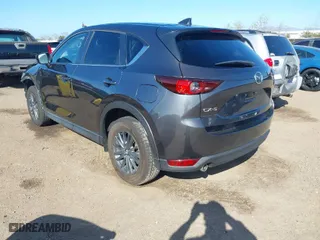 2021 Mazda CX-5 Touring with VIN JM3KFACM3M0381366, listed as a IAAI auction lot 41824942 with 35,417 mi miles. Bid and sale history available at carsss.com. Image 3.