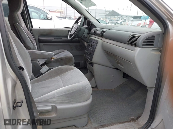 2005 Ford Freestar SE z VIN 2FMZA516X5BA42620, wystawiony jako IAAI lot #42163183 z przebiegiem 93 141 mil mil oraz . Historia ofert i sprzedaży dostępna na DreamBid. Obrazek 5.