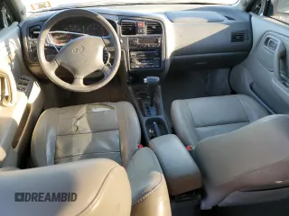 2002 Infiniti G20 Luxury z VIN JNKCP11A72T507242, wystawiony jako Copart lot #77325544 z przebiegiem 172 351 mil mil oraz Szkody całkowita. Historia ofert i sprzedaży dostępna na DreamBid. Obrazek 8.