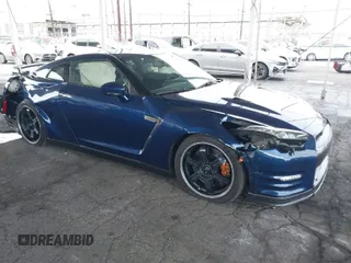 2013 Nissan GT-R Premium z VIN JN1AR5EF5DM260500, wystawiony jako IAAI lot #41760075 z przebiegiem 19 604 mil mil oraz . Historia ofert i sprzedaży dostępna na DreamBid. Obrazek 1.