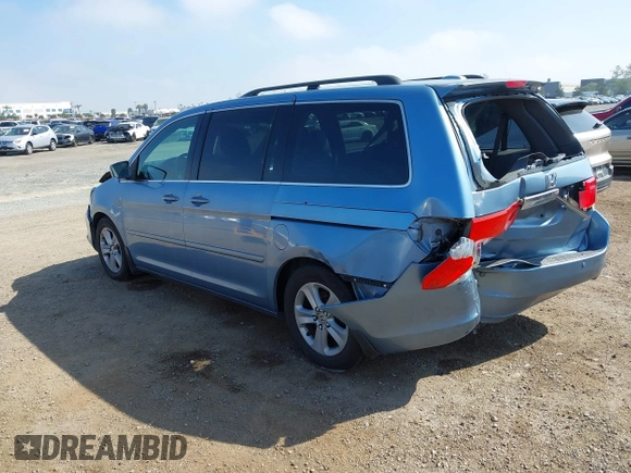2010 Honda Odyssey Touring with VIN 5FNRL3H92AB056186, listed as a IAAI auction lot 41851386 with 199,109 mi miles. Bid and sale history available at carsss.com. Image 3.