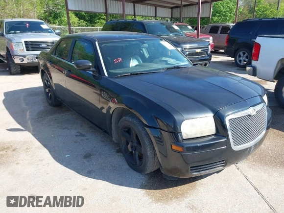 2005 Chrysler 300 with VIN 2C3JA43R65H668010, listed as a IAAI auction lot 41976405 with 216,099 mi miles. Bid and sale history available at carsss.com. Image 1.