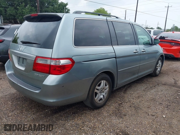 2005 Honda Odyssey EX with VIN 5FNRL38415B104920, listed as a IAAI auction lot 42094690 with 228,538 mi miles. Bid and sale history available at carsss.com. Image 4.