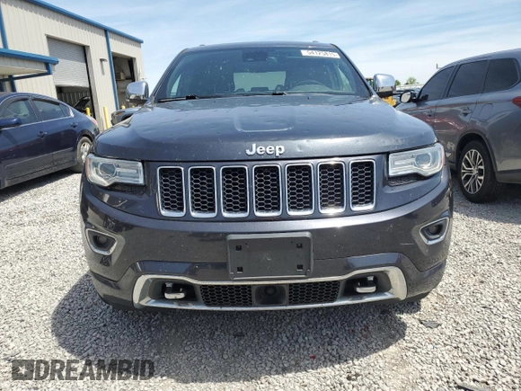 2016 Jeep Grand Cherokee Overland with VIN 1C4RJFCG9GC338165, listed as a Copart auction lot 54125815 with 102,302 mi miles and Salvage title. Bid and sale history available at DreamBid. Image 5.