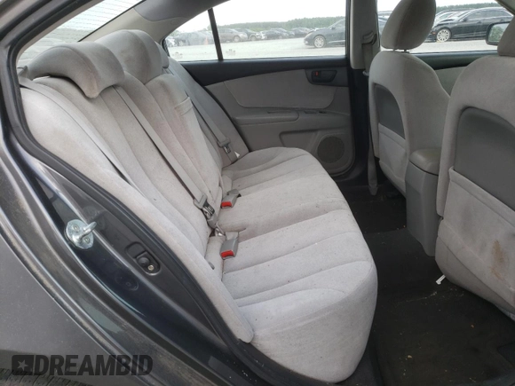 2009 Kia Optima LX z VIN KNAGE228695331919, wystawiony jako Copart lot #57804835 z przebiegiem 199 204 mil mil oraz Szkoda całkowita • Salvage title. Historia ofert i sprzedaży dostępna na DreamBid. Obrazek 10.
