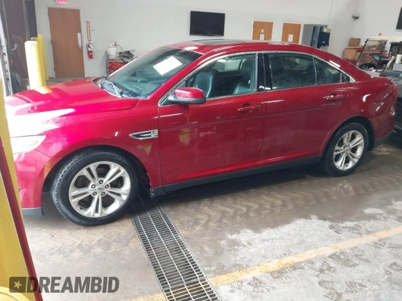 2013 Ford Taurus SEL with VIN 1FAHP2E99DG180535, listed as a IAAI auction lot 41741619 with 193,665 mi miles and . Bid and sale history available at carsss.com. Image 2.