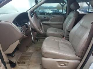 2001 Toyota Sienna LE z VIN 4T3ZF13C91U396296, wystawiony jako Copart lot #88094105 z przebiegiem 111 273 mil mil oraz Tytuł czysty. Historia ofert i sprzedaży dostępna na DreamBid. Obrazek 7.