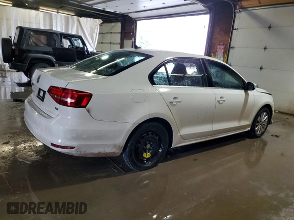 2015 Volkswagen Jetta SE with VIN 3VWD17AJ4FM308693, listed as a Copart auction lot 59987585 with 87,136 mi miles and Salvage title. Bid and sale history available at DreamBid. Image 3.